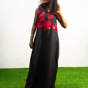 Black and Red Embroidery Jumpsuit  featuring a sleeveless black bodice with textured red floral embroidery and flowing wide-leg trousers.