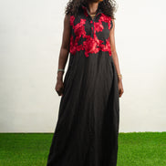 Black and Red Embroidery Jumpsuit  featuring a sleeveless black bodice with textured red floral embroidery and flowing wide-leg trousers.