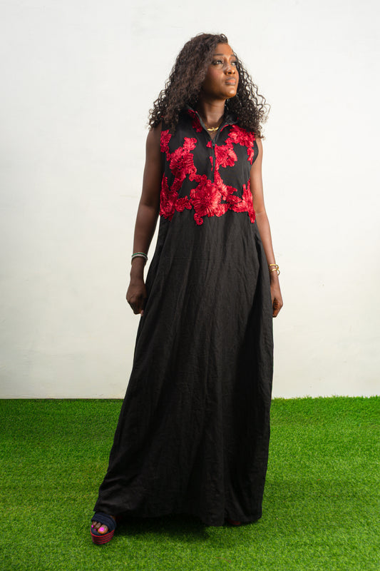 Black and Red Embroidery Jumpsuit  featuring a sleeveless black bodice with textured red floral embroidery and flowing wide-leg trousers.