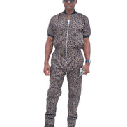 Short-sleeved jumpsuit featuring a brown and black animal print, a silver front zipper, and black ribbed cuffs