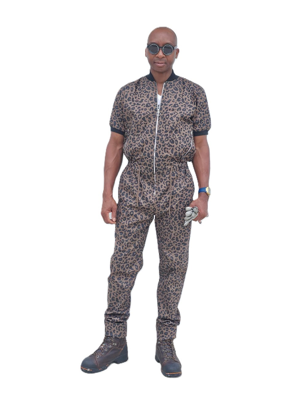 Short-sleeved jumpsuit featuring a brown and black animal print, a silver front zipper, and black ribbed cuffs