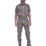 Short-sleeved jumpsuit featuring a brown and black animal print, a silver front zipper, and black ribbed cuffs