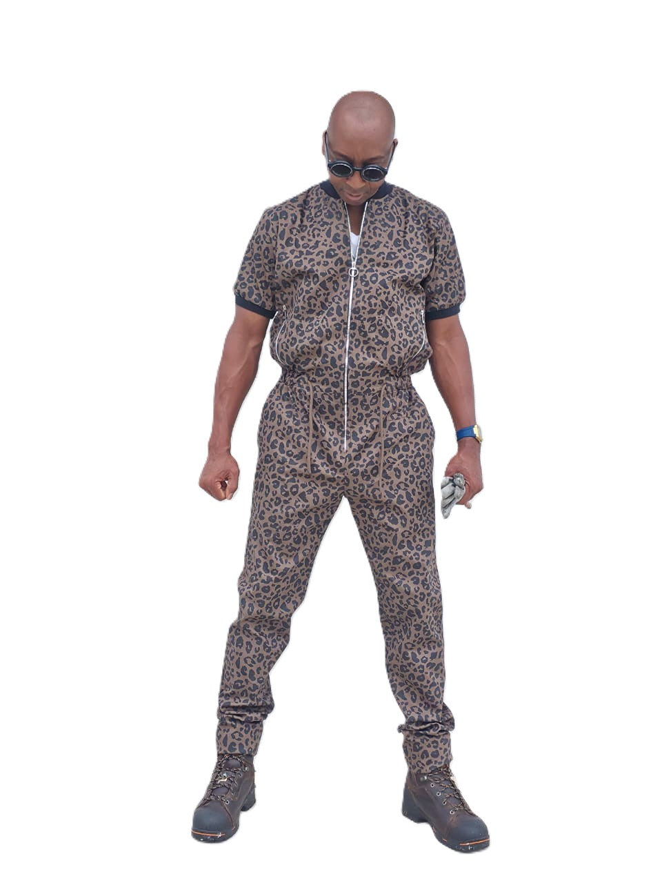Short-sleeved jumpsuit featuring a brown and black animal print, a silver front zipper, and black ribbed cuffs