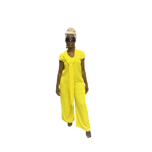 Jumpsuit featuring a sleeveless V-neckline, a prominent matching yellow neck tie, and long wide-leg trousers