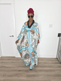 Aquatic Mosaic Boubou Kaftan featuring a teal and grey tile-patterned print with a structured black V-neck collar and flowing sleeves. Front View