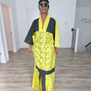 Bumblebee Boubou Kaftan in vibrant yellow textured fabric with bold black contrast panels and a matching black headwrap. Front View