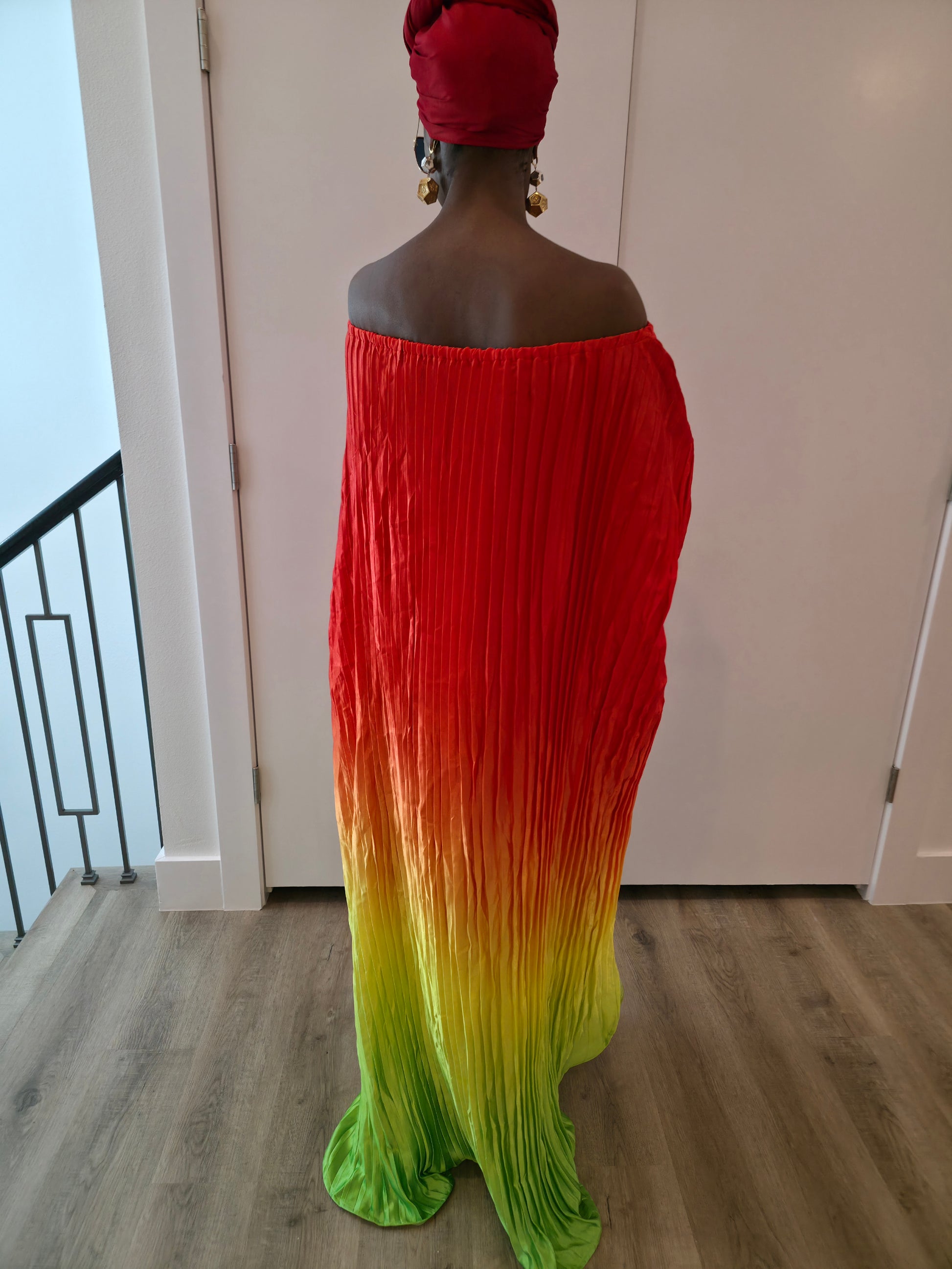 Pleated Ombre Kaftan available in red-green, yellow-pink, and pink-blue gradients, featuring a wide neckline and a flowing Boubou silhouette.