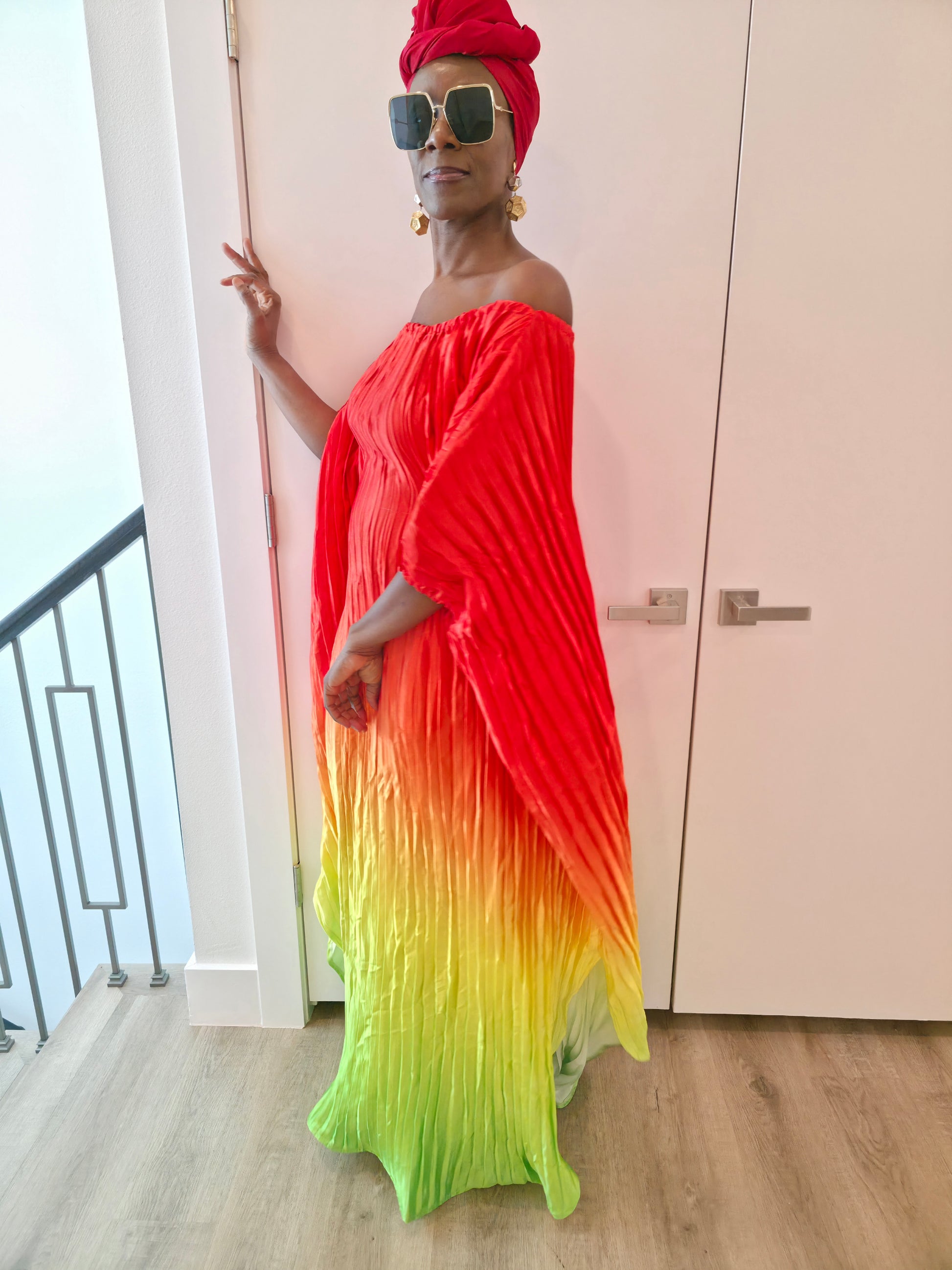 Pleated Ombre Kaftan available in red-green, yellow-pink, and pink-blue gradients, featuring a wide neckline and a flowing Boubou silhouette.