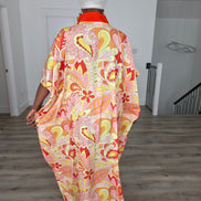 Citrus Sorbet Boubou Kaftan featuring a vibrant pink, orange, and yellow organic swirl pattern with a structured orange V-neck collar. Back View