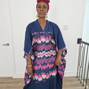 Cosmic Candy Boubou Kaftan in navy blue featuring a central horizontal panel with pink and lavender wavy patterns and a V-neck collar.