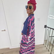 Cosmic Candy Boubou Kaftan in navy blue featuring a central horizontal panel with pink and lavender wavy patterns and a V-neck collar. Side View