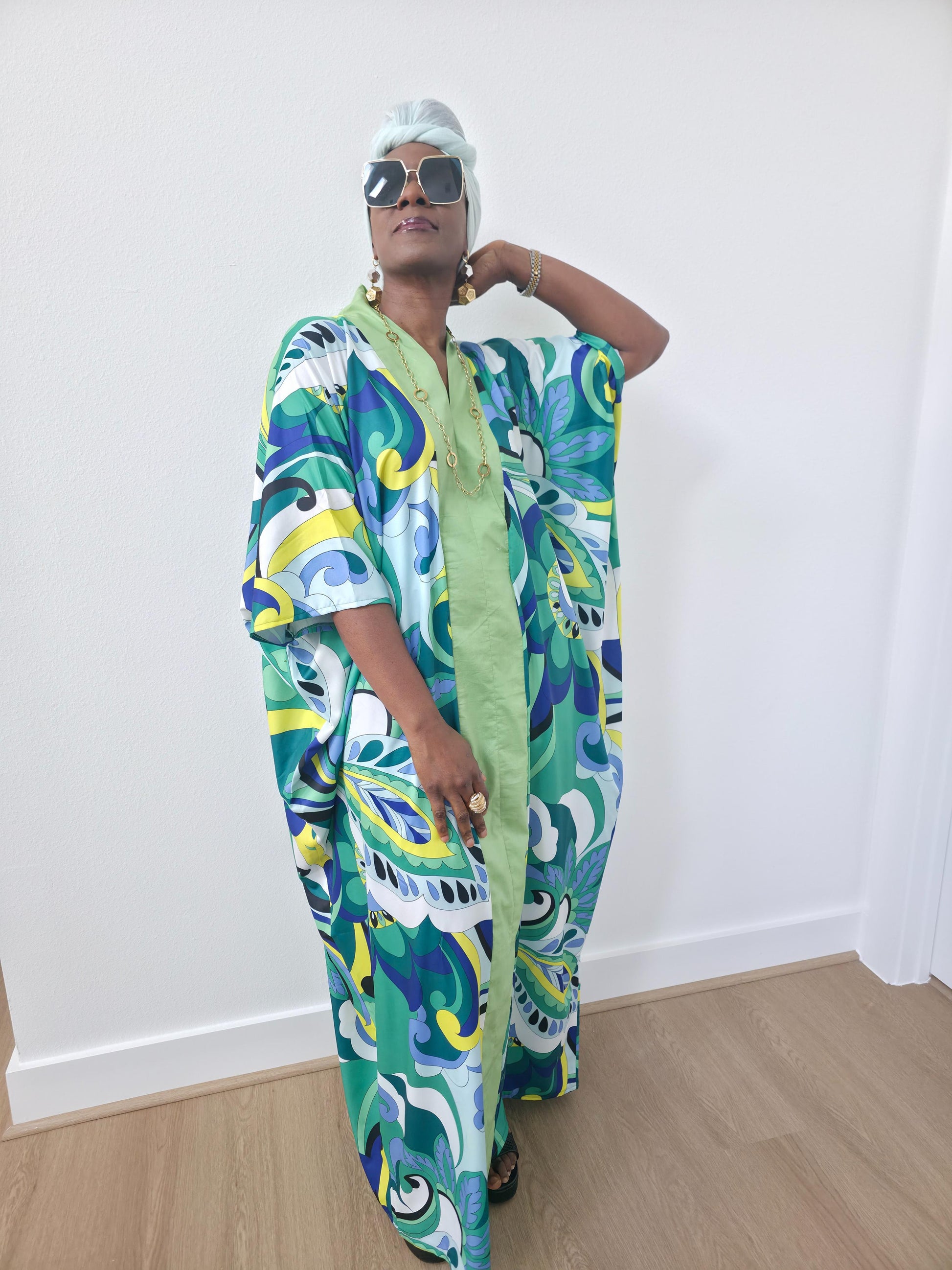 Emerald Paisley Boubou Kaftan with a solid lime-green center panel and a vibrant green, blue, and yellow paisley print. -Front View