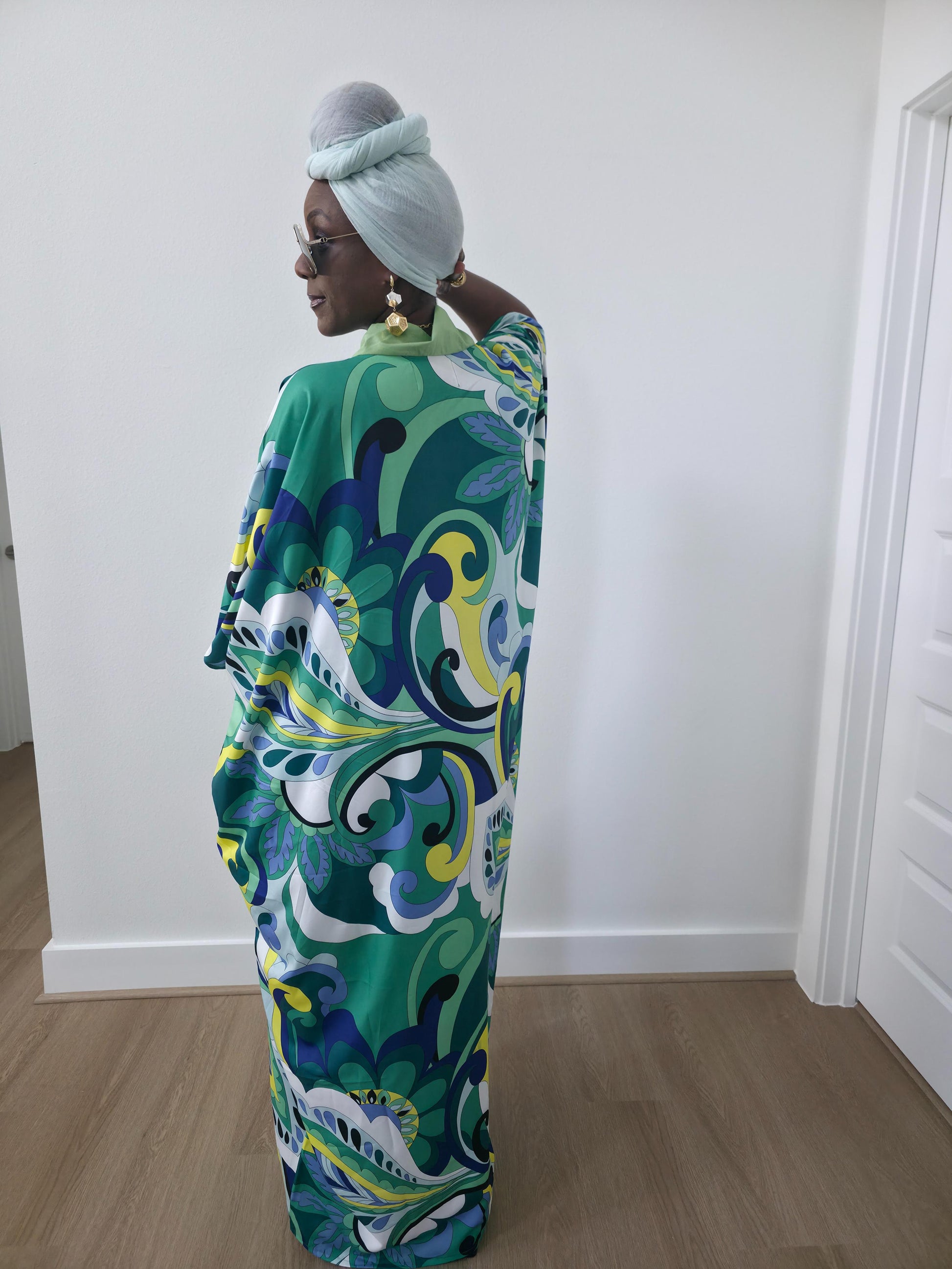Emerald Paisley Boubou Kaftan with a solid lime-green center panel and a vibrant green, blue, and yellow paisley print. - Back View