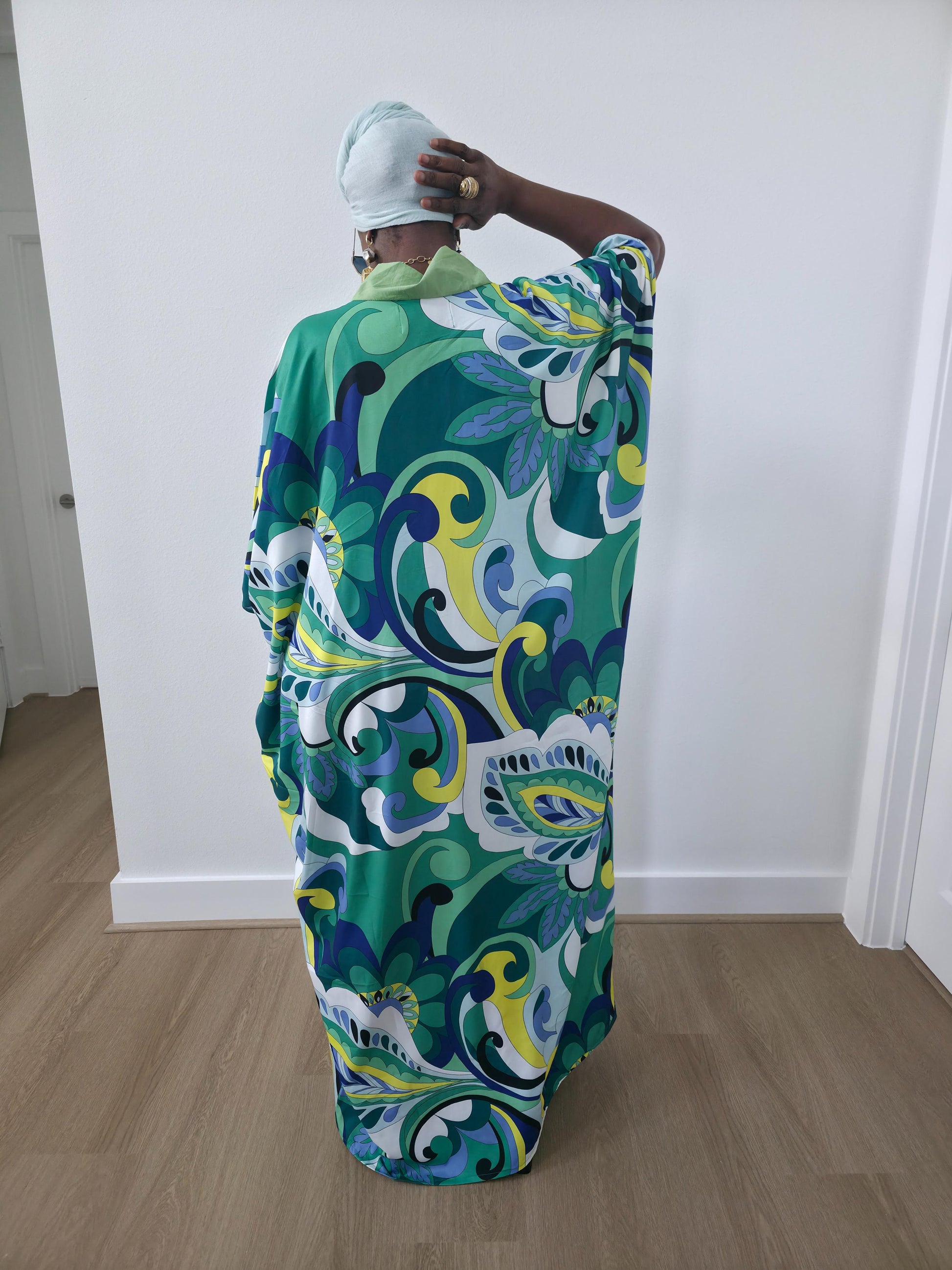 Emerald Paisley Boubou Kaftan with a solid lime-green center panel and a vibrant green, blue, and yellow paisley print. - Full Back View