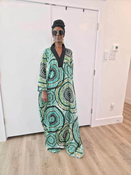Patterned Boubou Kaftan featuring a green and black concentric circular print, a solid black V-neckline, and a wide-wing silhouette.