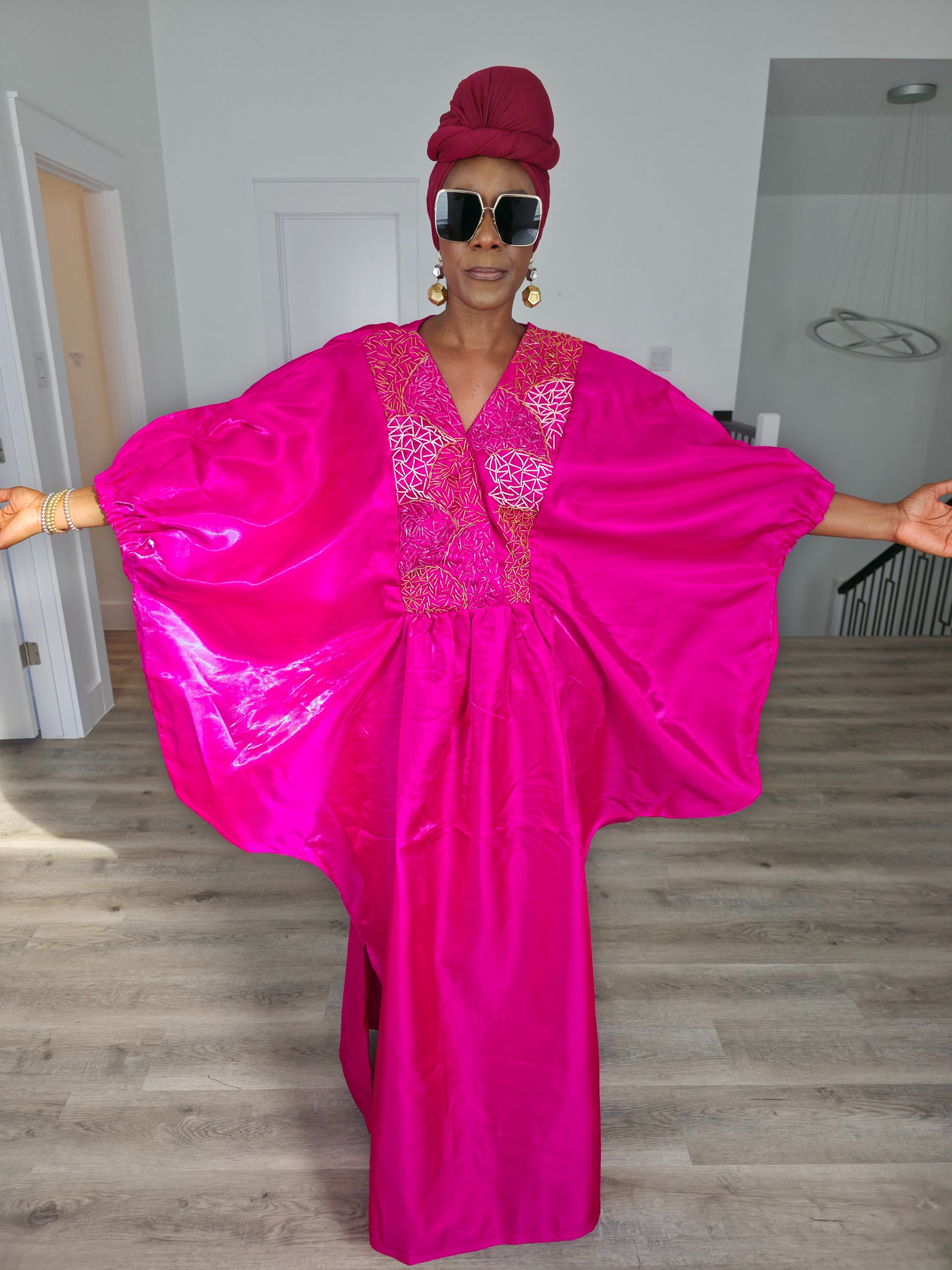 Fuchsia Brilliance Boubou Kaftan in deep pink silk-satin with an intricate gold embroidered V-neckline. Women's Wear