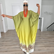 Gilded Olive Boubou Kaftan featuring an olive green and yellow gradient design with an orange V-neck collar and intricate paisley patterns along the hem. Front View