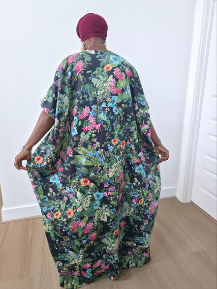 Green floral boubou kaftan featuring a vibrant pink and blue botanical pattern with a flowing, floor-length silhouette -BackView