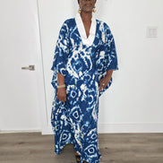 Ink & Alabaster Boubou Kaftan featuring a deep blue and white tie-dye circular pattern with a crisp white V-neck collar.