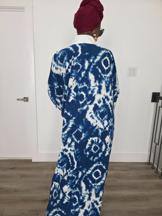 Ink & Alabaster Boubou Kaftan featuring a deep blue and white tie-dye circular pattern with a crisp white V-neck collar. Back View