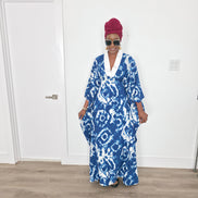 Ink & Alabaster Boubou Kaftan featuring a deep blue and white tie-dye circular pattern with a crisp white V-neck collar.