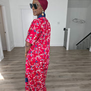 Midnight Poppy Boubou Kaftan in deep red with a white and blue floral print, featuring a navy blue collar and matching burgundy headwrap. Side back view