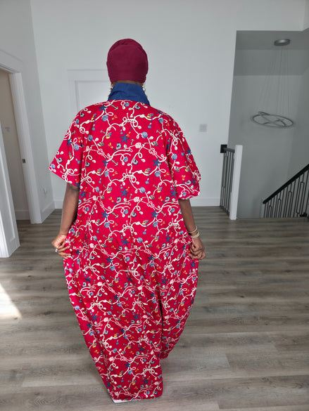 Midnight Poppy Boubou Kaftan in deep red with a white and blue floral print, featuring a navy blue collar and matching burgundy headwrap. Back View