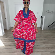 Midnight Poppy Boubou Kaftan in deep red with a white and blue floral print, featuring a navy blue collar and matching burgundy headwrap. Front View