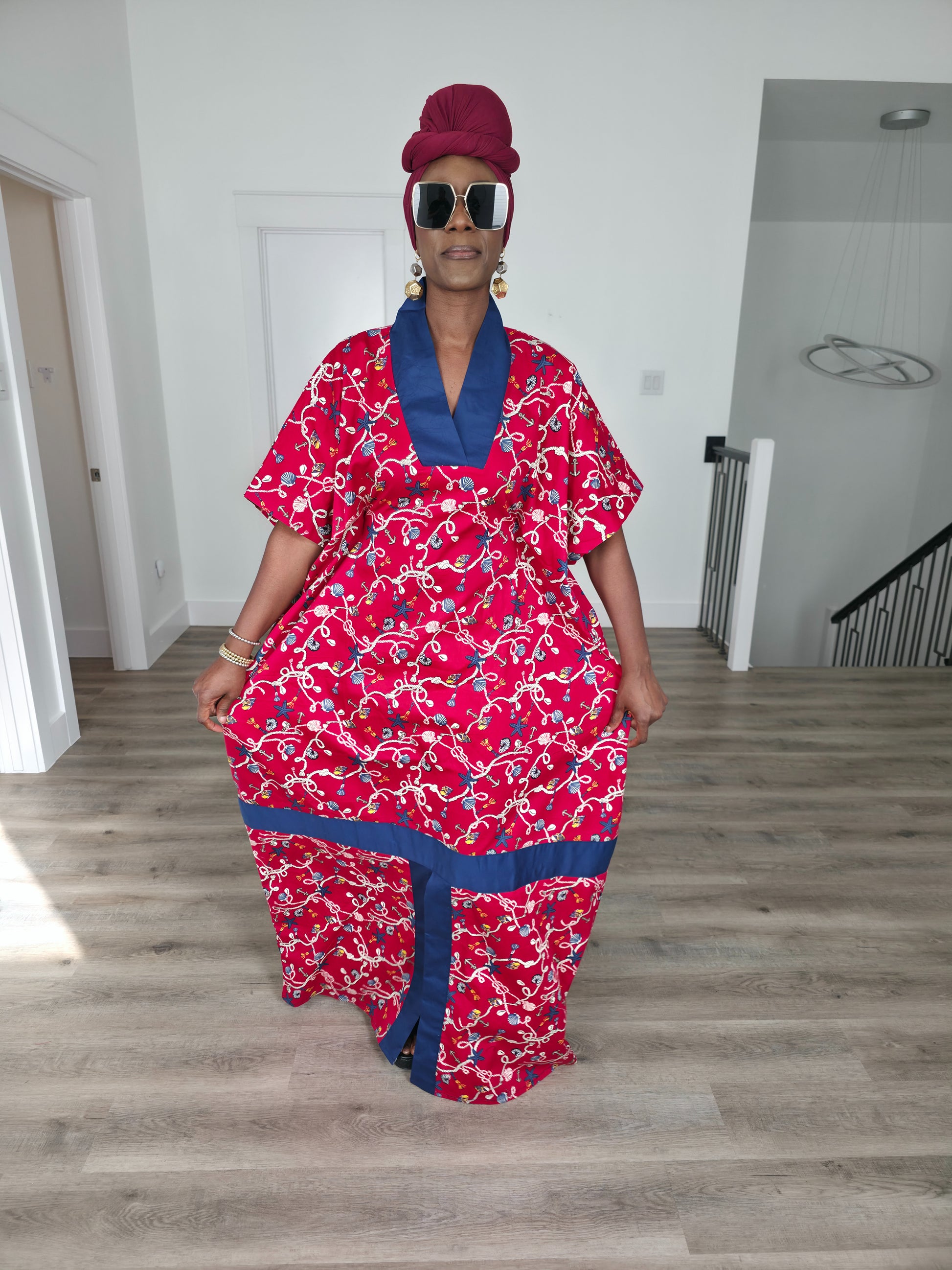 Midnight Poppy Boubou Kaftan in deep red with a white and blue floral print, featuring a navy blue collar and matching burgundy headwrap. Front View