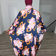 Painted Twilight Boubou Kaftan in deep navy blue featuring large, abstract pink and orange floral prints with a soft pink V-neck collar. Back View