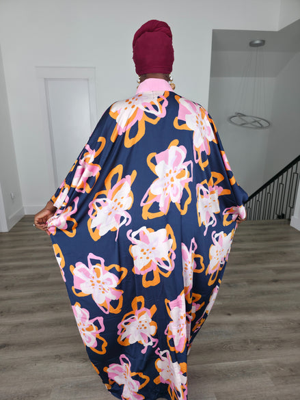 Painted Twilight Boubou Kaftan in deep navy blue featuring large, abstract pink and orange floral prints with a soft pink V-neck collar. Back View