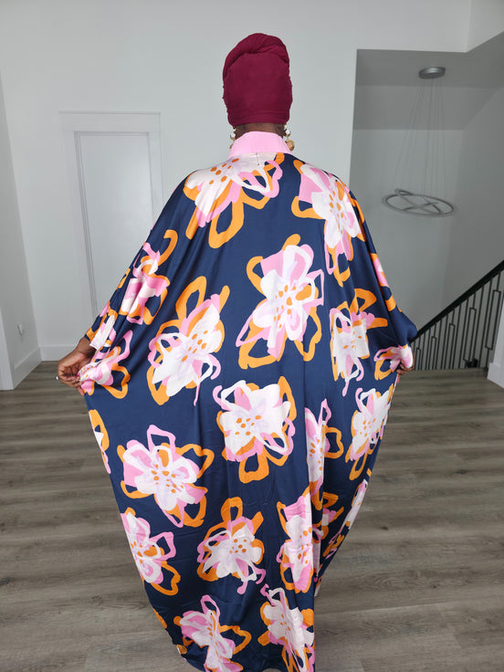 Painted Twilight Boubou Kaftan in deep navy blue featuring large, abstract pink and orange floral prints with a soft pink V-neck collar. Back View