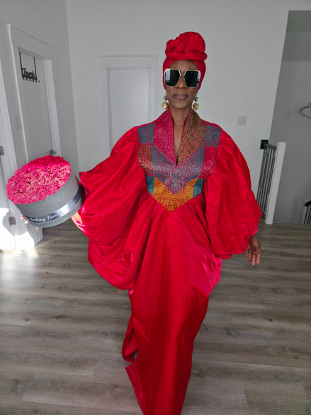 Rubied Prism Boubou Kaftan in vibrant red with a colorful geometric embroidered neckline and matching red headwrap. Women's Wear
