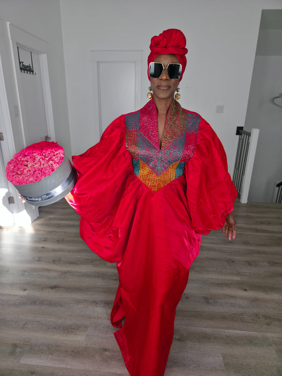 Rubied Prism Boubou Kaftan in vibrant red with a colorful geometric embroidered neckline and matching red headwrap. Women's Wear