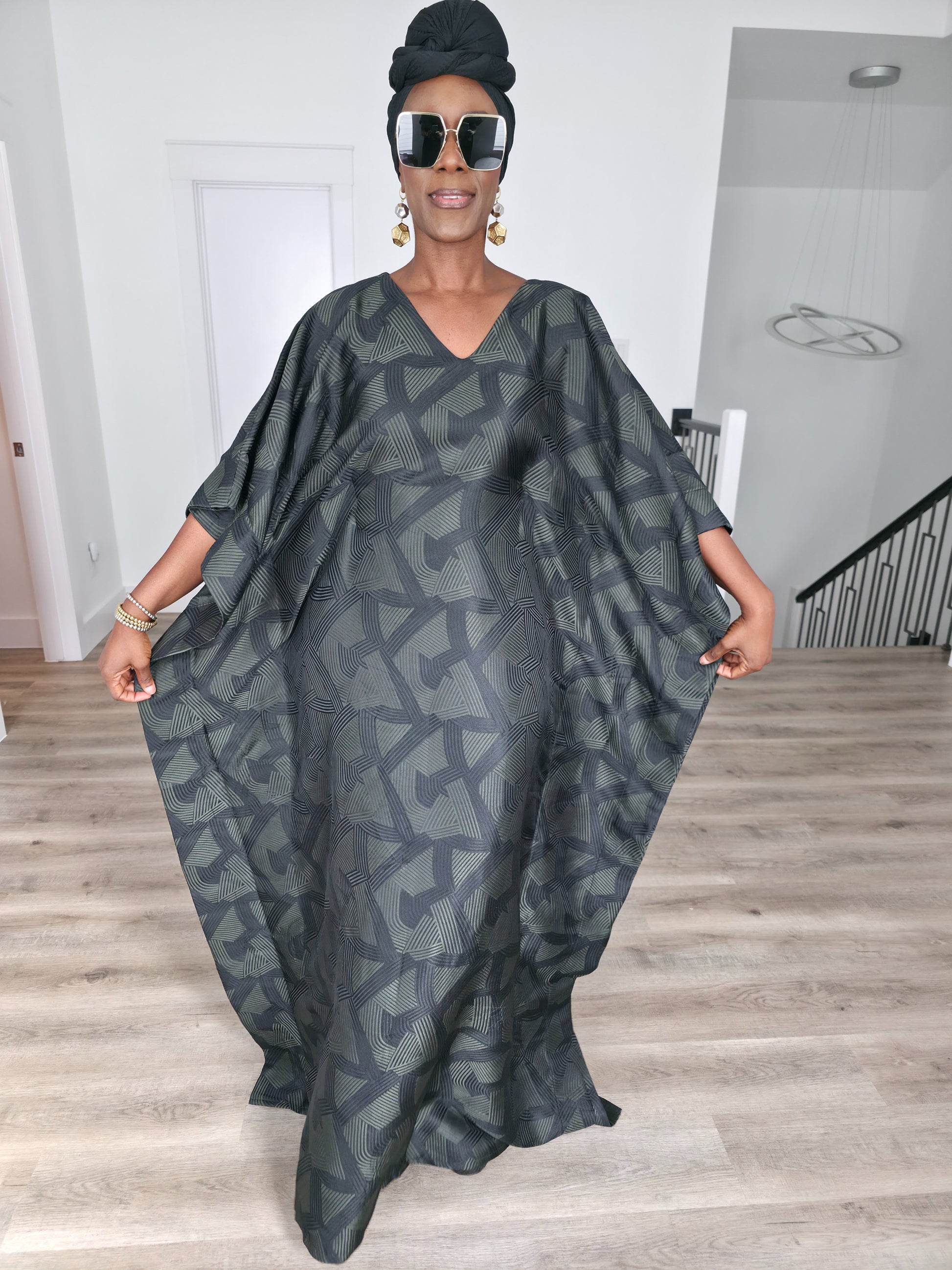 Shadowed Flint Boubou Kaftan featuring a dark grey and black geometric abstract print with a matching black headwrap. Front View