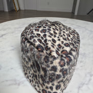 Afrocentric Kufi cap featuring a bold leopard animal print on a textured velvet fabric with a foldable, structured silhouette.