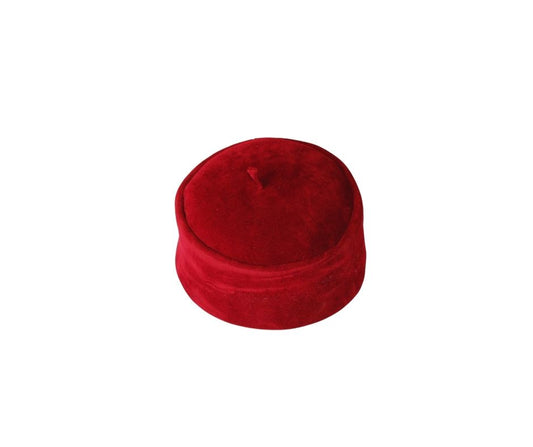 Kufi Hat featuring a circular crimson red velvet crown with a structured side band and a small top tassel.