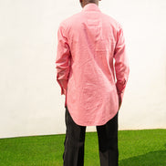 Long Sleeve Shirt featuring a vibrant pink textured fabric, a pleated tuxedo-style chest plate, dark contrast buttons, and a structured mandarin neckline. Back View 