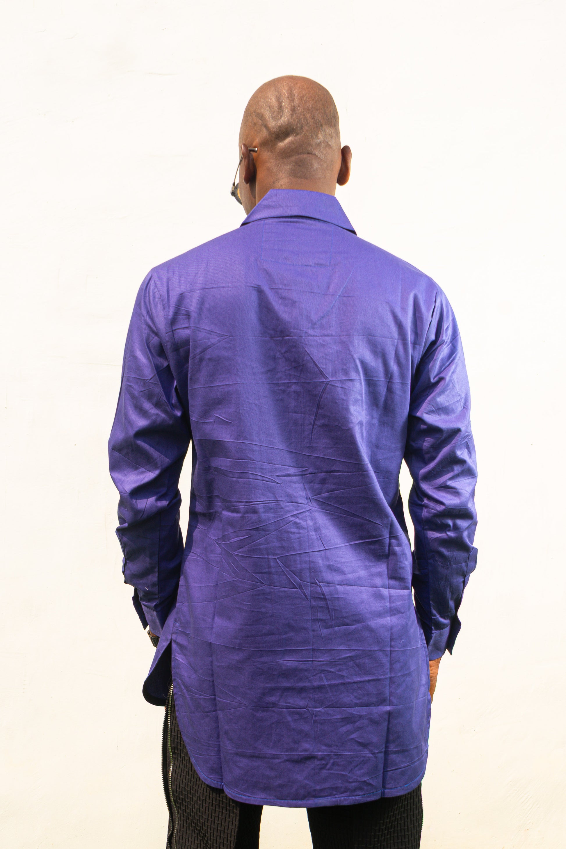 Long Sleeve Shirt featuring a vibrant royal blue cotton tunic with a prominent black central zipper, two chest pockets, and a classic collar. Back View.