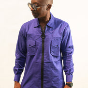 Long Sleeve Shirt featuring a vibrant royal blue cotton tunic with a prominent black central zipper, two chest pockets, and a classic collar. Front.