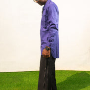 Long Sleeve Shirt featuring a vibrant royal blue cotton tunic with a prominent black central zipper, two chest pockets, and a classic collar. Side View.
