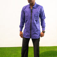 Long Sleeve Shirt featuring a vibrant royal blue cotton tunic with a prominent black central zipper, two chest pockets, and a classic collar.