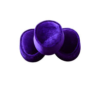 Nze Cap featuring a deep amethyst purple velvet, a structured oval top, and a matching velvet-covered base.
