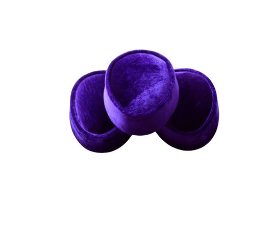 Nze Cap featuring a deep amethyst purple velvet, a structured oval top, and a matching velvet-covered base.