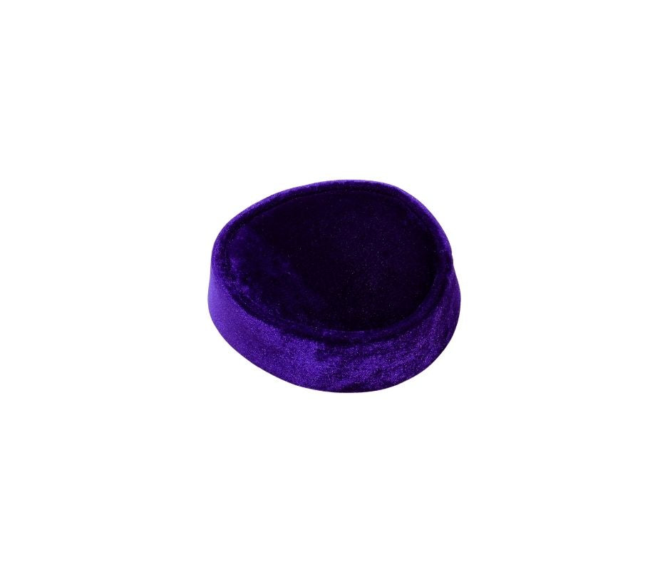 Nze Cap featuring a deep amethyst purple velvet, a structured oval top, and a matching velvet-covered base.
