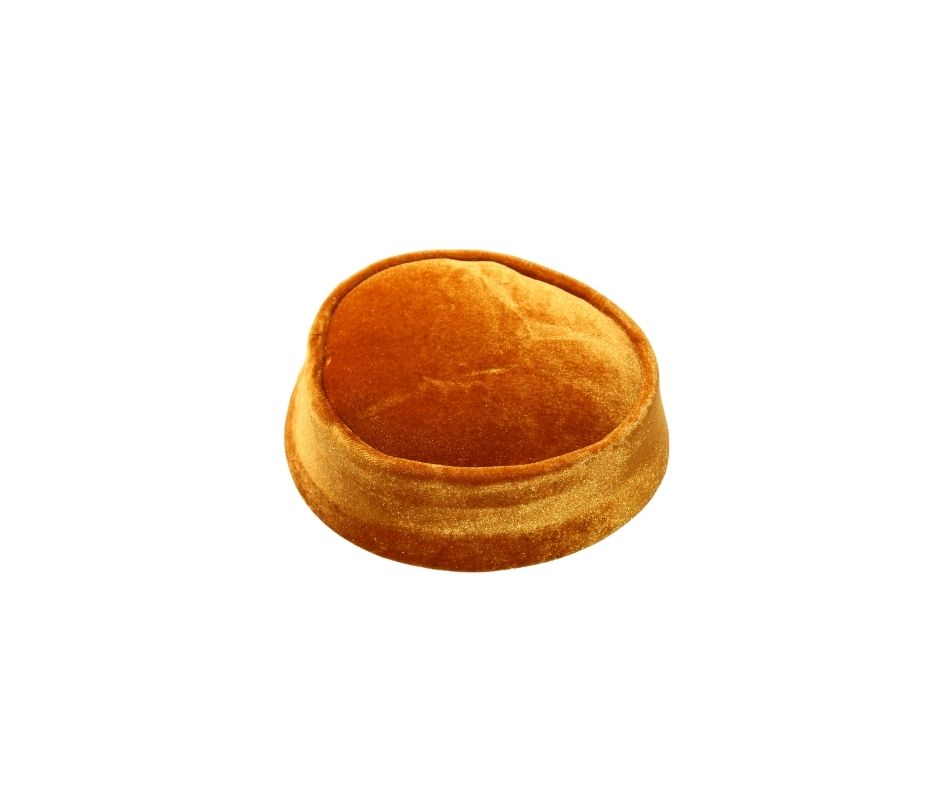 Nze Cap featuring a vibrant marigold orange velvet body and a classic oval-shaped crown
