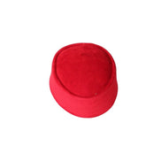 Nze Cap featuring a vibrant ruby red velvet texture, a structured oval top, and a matching fabric-wrapped brim.