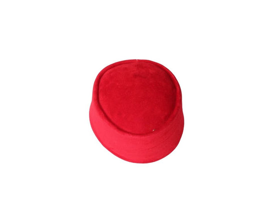Nze Cap featuring a vibrant ruby red velvet texture, a structured oval top, and a matching fabric-wrapped brim.