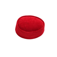 Nze Cap featuring a vibrant ruby red velvet texture, a structured oval top, and a matching fabric-wrapped brim.