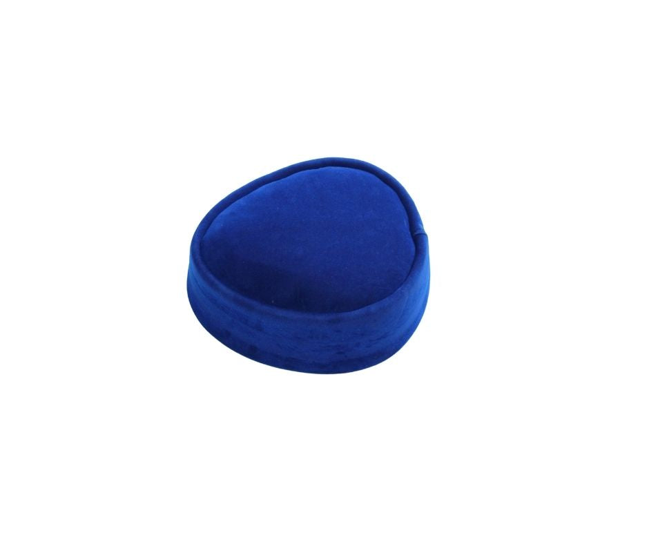 Nze Cap featuring a rich royal blue velvet texture, an oval-shaped crown, and a reinforced circular brim.